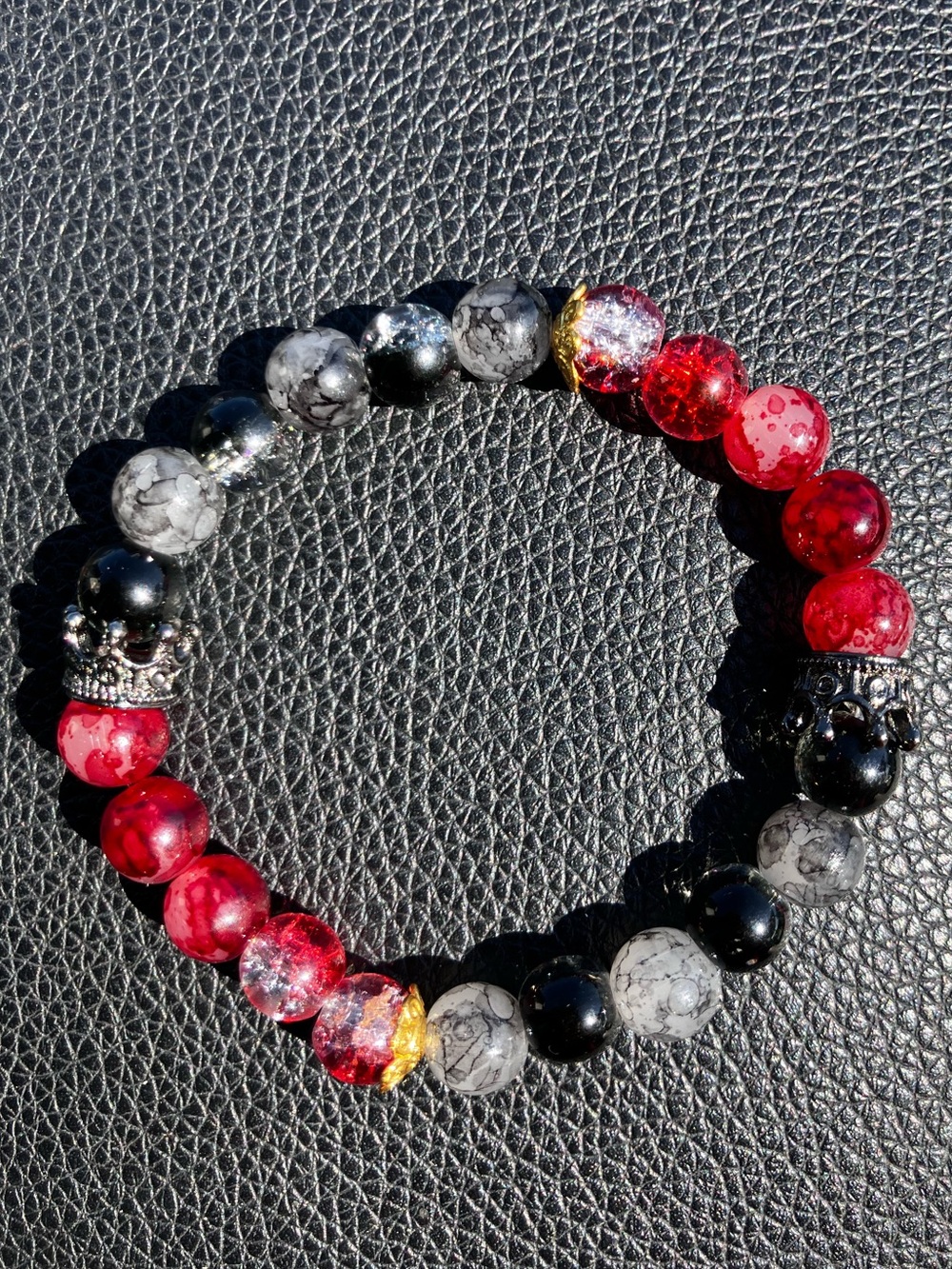 Black and red with black crown and gold accent glass beaded bracelet